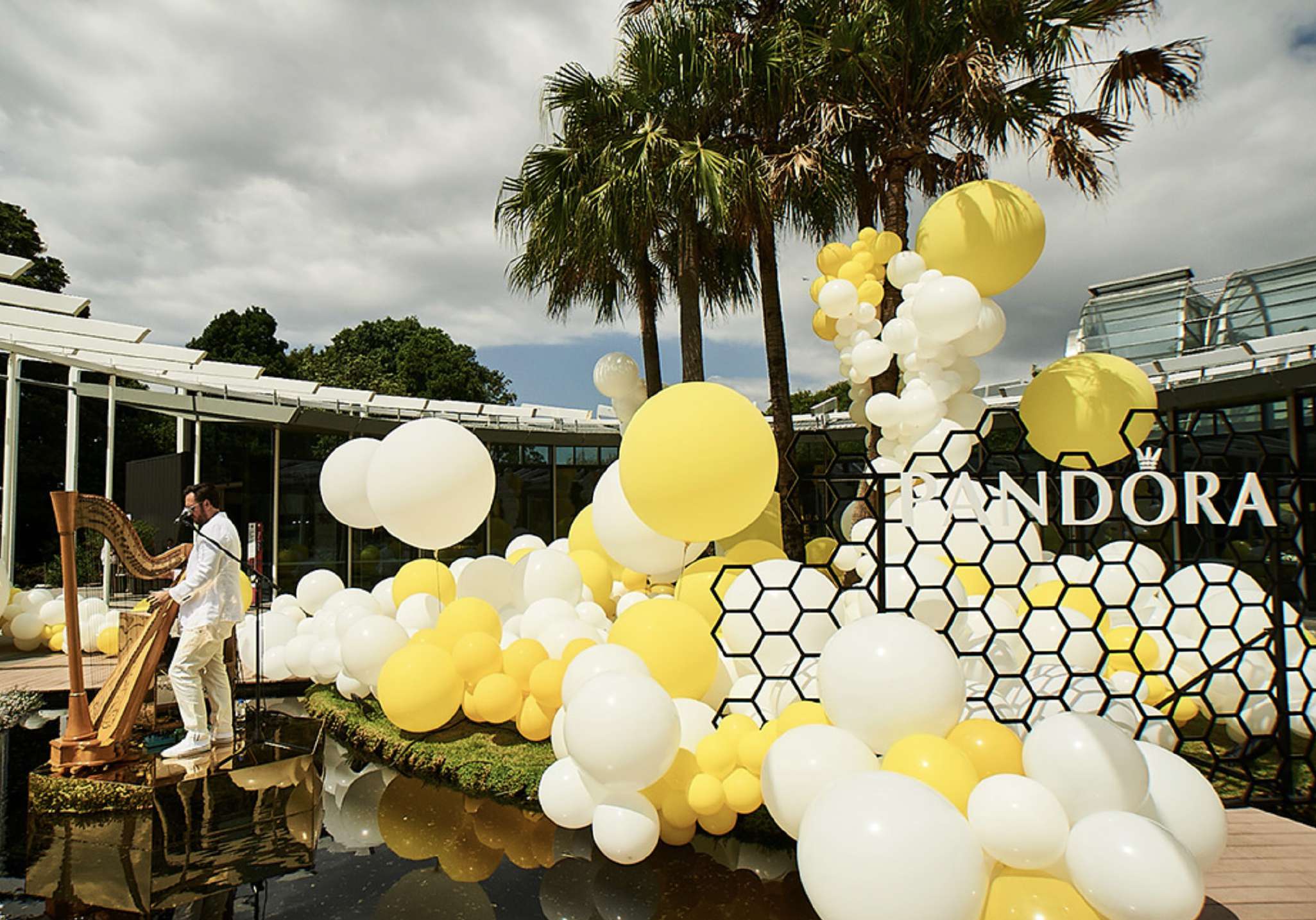 Pandora media wall with harpist over water