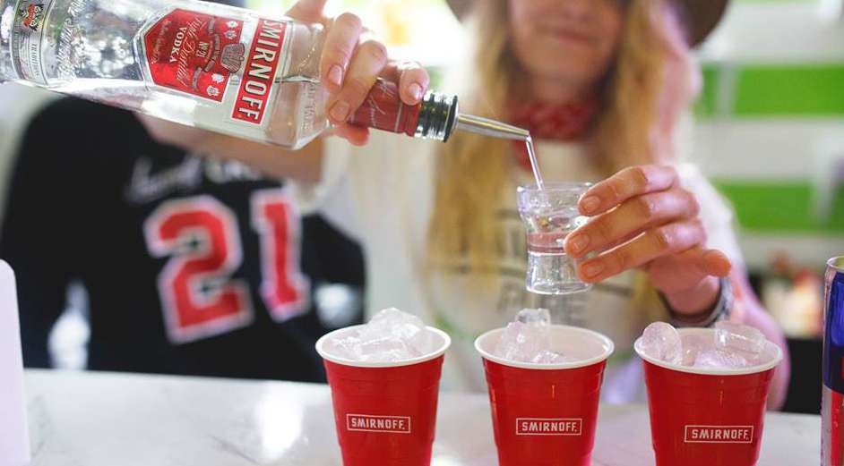 Pouring drinks at the Smirnoff bar